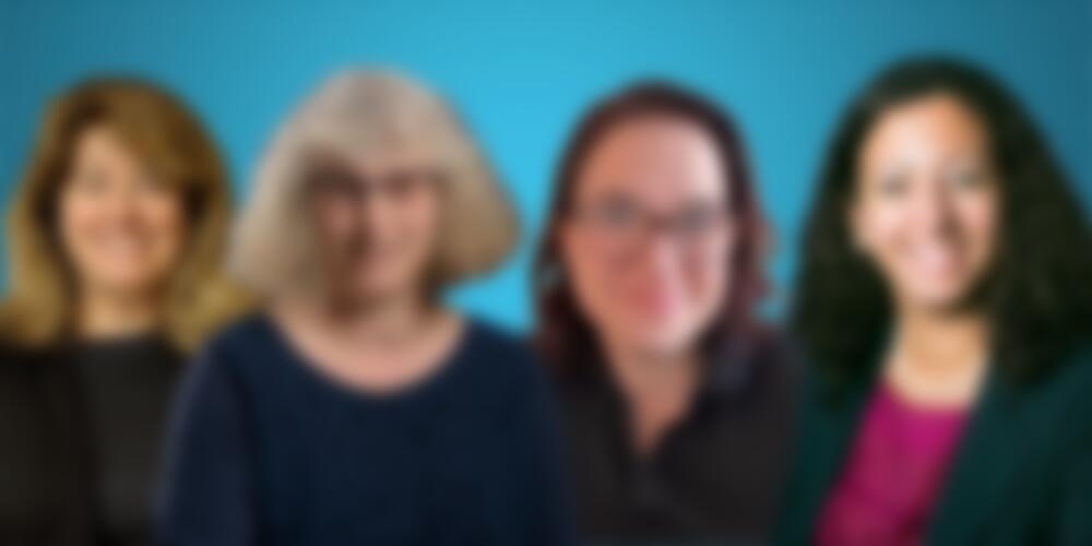 Headshots of Monica Fabiani, Lisa Travis, Caroline Tancredy, and Christine Shenouda against a blue background