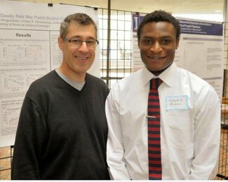 Professor Josh Gulley and Olubankole Arogundade at 2014 Honors Poster Presentation