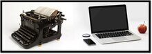 typewriter next to an apple laptop