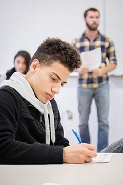 Student taking notes in class