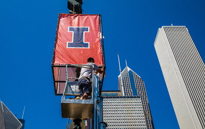 staff preparing an Illinois banner