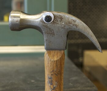 Hammer with googly eye glued on