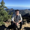 Dr. Zhang on top of a mountain