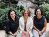 From left to right, Professors Tancredy, Travis, and Shenouda sitting together in front of the plants housed in the Psychology building atrium