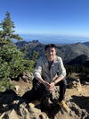 Dr. Zhang on top of a mountain