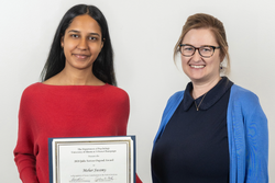 Meher Swamy holding award certificate with Diane Beck